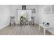 Bright sitting area features a large window, neutral decor, and wood-look floors at 10234 Lenox St, Clermont, FL 34711