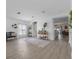 Open living room features stylish decor, sleek floors and an inviting atmosphere at 10234 Lenox St, Clermont, FL 34711