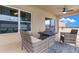 Covered patio with outdoor seating, ceiling fan and open backyard views at 10234 Lenox St, Clermont, FL 34711