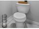 Close-up of a clean, white toilet with a minimalist design and tiled floor at 10234 Lenox St, Clermont, FL 34711