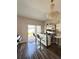 Entertainment bar with stools, a chandelier, and sliding glass doors leading to the backyard at 1056 Naes Ln, Lake Wales, FL 33853