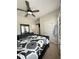 Bedroom with ceiling fan, with an ensuite bathroom and walk-in closet at 1056 Naes Ln, Lake Wales, FL 33853