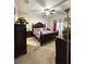 Spacious bedroom with a ceiling fan, carpet, and a window with curtains at 1056 Naes Ln, Lake Wales, FL 33853