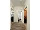 Hallway showcasing new floors leading to bedrooms and bathroom at 1056 Naes Ln, Lake Wales, FL 33853