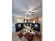 Expansive living room featuring dark leather furniture and open layout, perfect for entertaining guests at 1056 Naes Ln, Lake Wales, FL 33853