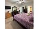 Comfortable main bedroom with carpet flooring, a ceiling fan, and ample space for furnishings at 1056 Naes Ln, Lake Wales, FL 33853