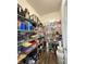 Walk-in pantry with floor-to-ceiling wire shelves filled with neatly organized kitchen essentials at 1056 Naes Ln, Lake Wales, FL 33853