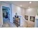 Upstairs hallway featuring carpet, wall decor, and an open view to another room at 1091 Sugarwood St, Davenport, FL 33837