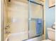 Bathroom with a shower featuring a glass door and chrome fixtures, and blue towel at 11 Sun Air Blvd E, Haines City, FL 33844