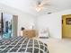 Bright bedroom with chair, dresser and door to the lanai with scenic view at 11 Sun Air Blvd E, Haines City, FL 33844