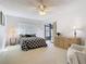 Spacious bedroom featuring a ceiling fan, and sliding glass doors to the lanai at 11 Sun Air Blvd E, Haines City, FL 33844