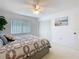 Inviting bedroom with a ceiling fan, closet and a light-filled window at 11 Sun Air Blvd E, Haines City, FL 33844