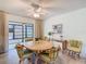 Cozy dining room features a wood table and chairs with sliding door to outside at 11 Sun Air Blvd E, Haines City, FL 33844