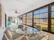 Enclosed lanai with multiple windows overlooking the backyard at 11 Sun Air Blvd E, Haines City, FL 33844