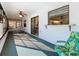 Relaxing lanai with white furnishings, ceiling fan, and access to the main house at 11 Sun Air Blvd E, Haines City, FL 33844