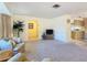 Inviting living room featuring neutral carpeting and open access to the kitchen and hallway at 11 Sun Air Blvd E, Haines City, FL 33844