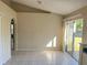 Cozy dining area with tiled flooring, a slider to the patio, and arched entryways for a welcoming atmosphere at 1106 Partridge Way, Kissimmee, FL 34759