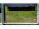 Birds eye view of a home and backyard with lush lawn and full fencing at 1108 Zion Dr, Haines City, FL 33844