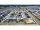 Wide aerial shot of a residential neighborhood, showcasing a community layout with numerous homes at 1108 Zion Dr, Haines City, FL 33844