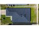 High angle aerial view of the home's roof and back yard, featuring a dark shingle roof at 1108 Zion Dr, Haines City, FL 33844