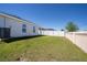 Spacious backyard with lush lawn and full fencing at 1108 Zion Dr, Haines City, FL 33844