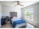 Cozy bedroom filled with natural light, complemented by functional desk space and simple stylish touches at 1108 Zion Dr, Haines City, FL 33844