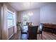 Dining area featuring a chandelier, natural light, and wood-look flooring at 1108 Zion Dr, Haines City, FL 33844