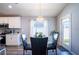 Cozy dining area featuring stylish chandelier and easy access to the kitchen at 1108 Zion Dr, Haines City, FL 33844