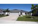 Charming single-story home with a well-maintained lawn and attached two-car garage at 1108 Zion Dr, Haines City, FL 33844