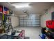 Spacious two-car garage with ample storage space and a well-maintained interior, ideal for organization at 1108 Zion Dr, Haines City, FL 33844