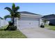 Attached two-car garage with extended driveway at 1108 Zion Dr, Haines City, FL 33844