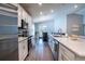Bright, open kitchen featuring modern appliances, granite countertops, and ample cabinet space at 1108 Zion Dr, Haines City, FL 33844
