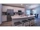 Open kitchen featuring modern appliances, a large island with seating, and ample cabinet space at 1108 Zion Dr, Haines City, FL 33844
