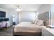 Stylish main bedroom features a plush bed, elegant lighting, and a serene atmosphere, perfect for unwinding at 1108 Zion Dr, Haines City, FL 33844