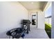 Covered patio with outdoor kitchen area with grill and outdoor access at 1108 Zion Dr, Haines City, FL 33844