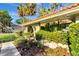 Beautiful landscaped walkway leading to the arched entryway and front door of this home at 1116 Cypress W Pt, Winter Haven, FL 33884