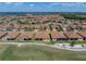 Serene community featuring cozy homes, picturesque ponds, and lush green spaces, perfect for relaxation and recreation at 1124 Sawgrass Dr, Winter Haven, FL 33884