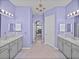 Bathroom featuring modern vanities, soaking tub, and plenty of open space at 1124 Sawgrass Dr, Winter Haven, FL 33884