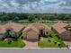 Charming home with manicured lawn and mature landscaping, showcasing its inviting curb appeal at 1124 Sawgrass Dr, Winter Haven, FL 33884
