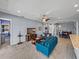 Open-concept living room with a view of the dining area, kitchen, and comfortable seating at 1124 Sawgrass Dr, Winter Haven, FL 33884