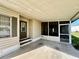 Covered carport featuring direct access to the front door and a convenient adjacent screened area at 114 Jana Cir, Auburndale, FL 33823