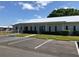 The community clubhouse features a covered entryway with parking at 114 Jana Cir, Auburndale, FL 33823