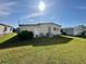 Well-maintained exterior of home with green lawn, providing a tranquil setting and curb appeal at 114 Jana Cir, Auburndale, FL 33823