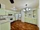 Well-lit kitchen featuring updated appliances and ample cabinet space at 114 Jana Cir, Auburndale, FL 33823
