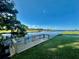 This is the community waterfront, with mature trees and a small dock at 114 Jana Cir, Auburndale, FL 33823