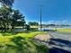 This is the community waterfront, with mature trees and a path to a small dock at 114 Jana Cir, Auburndale, FL 33823