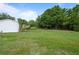 Expansive backyard with lush greenery and room for various outdoor activities at 1302 Windsong Dr, Lakeland, FL 33811