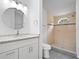 Stylish bathroom featuring a tiled shower and a modern vanity at 1302 Windsong Dr, Lakeland, FL 33811