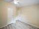 Bright bedroom featuring stylish flooring and a ceiling fan at 1302 Windsong Dr, Lakeland, FL 33811