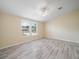 Inviting bedroom filled with natural light from large windows and stylish flooring at 1302 Windsong Dr, Lakeland, FL 33811